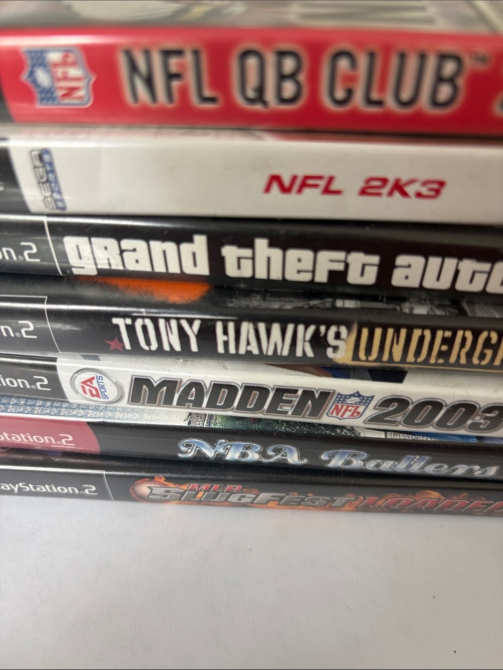 Sony PlayStation 2 Game Spine Lot — Red, White, Black Accents